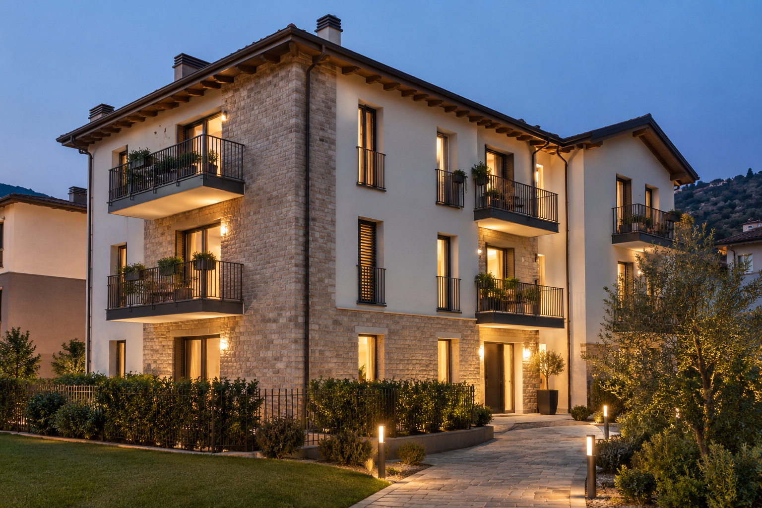 Complesso residenziale contemporaneo con illuminazione interna ed esterna